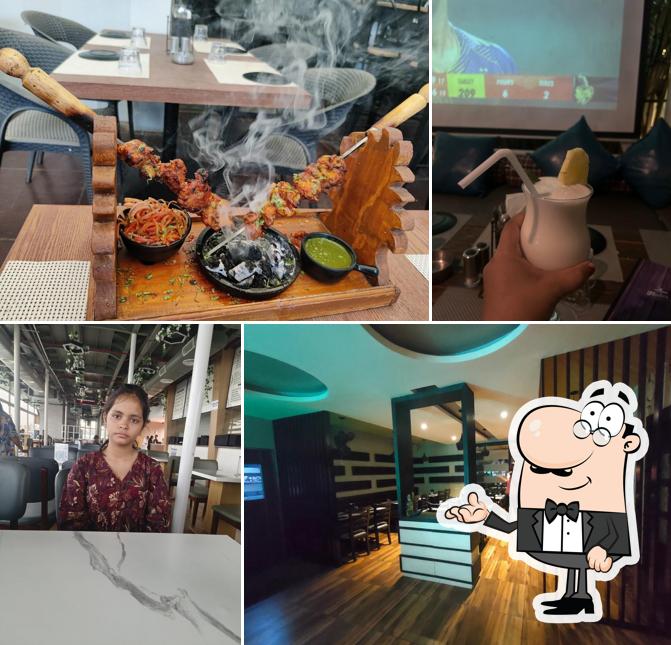 Take a seat at one of the tables at Flute Resto & Bar