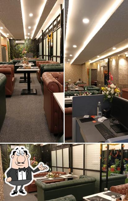 Take a seat at one of the tables at PAPRIKA CAFE AND RESTAURANT