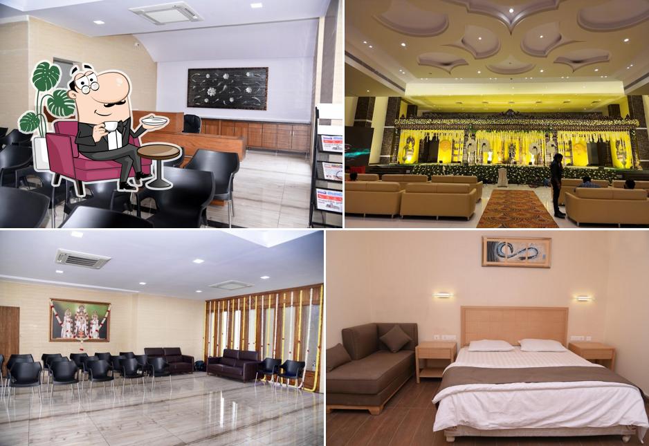 Take a seat at one of the tables at Babu & Babu Convention and Rooms