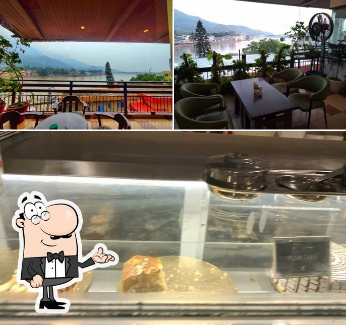 Take a seat at one of the tables at Sanskriti - A Ganga View Cafe