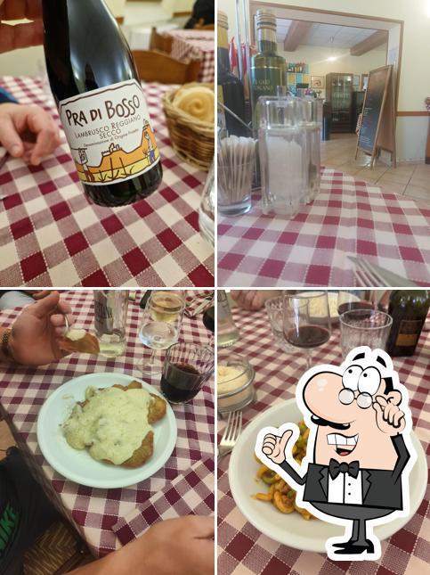 Siediti a un tavolo di Trattoria La Bassa