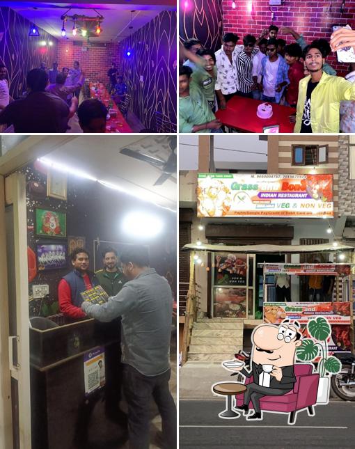 Take a seat at one of the tables at Grass and Bone Indian Restaurant