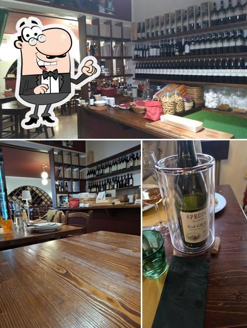 Dai un'occhiata agli interni di Osteria Bar 77