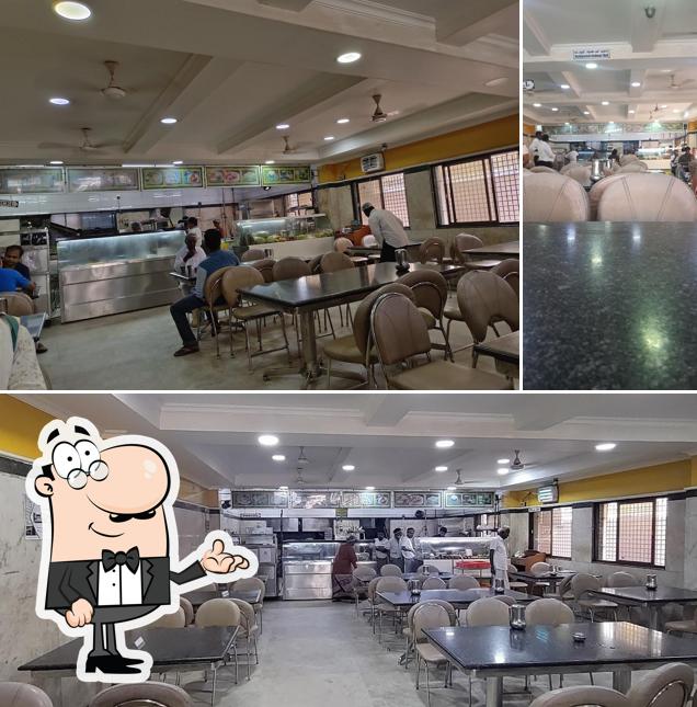 Take a seat at one of the tables at Saravana Bhavan