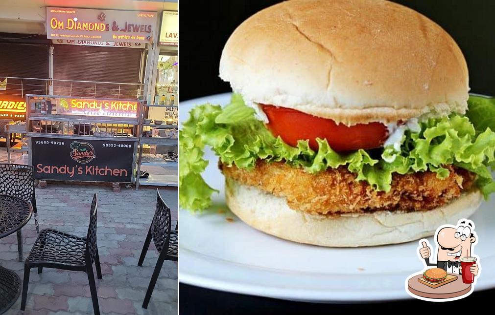 Order a burger at Sandy's Kitchen