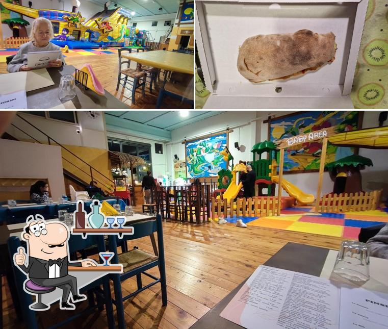 La foto di interni e cibo da Pizzeria parco giochi l'isola che non c'è