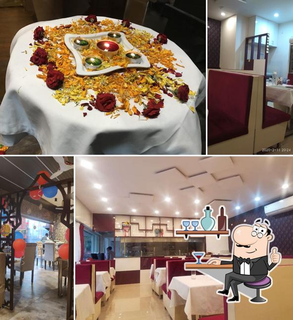 Take a seat at one of the tables at Nitchal Grand Restaurant