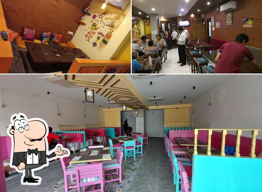 Take a seat at one of the tables at The Dhaba