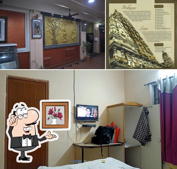 Take a seat at one of the tables at Ajatsatru Hotel