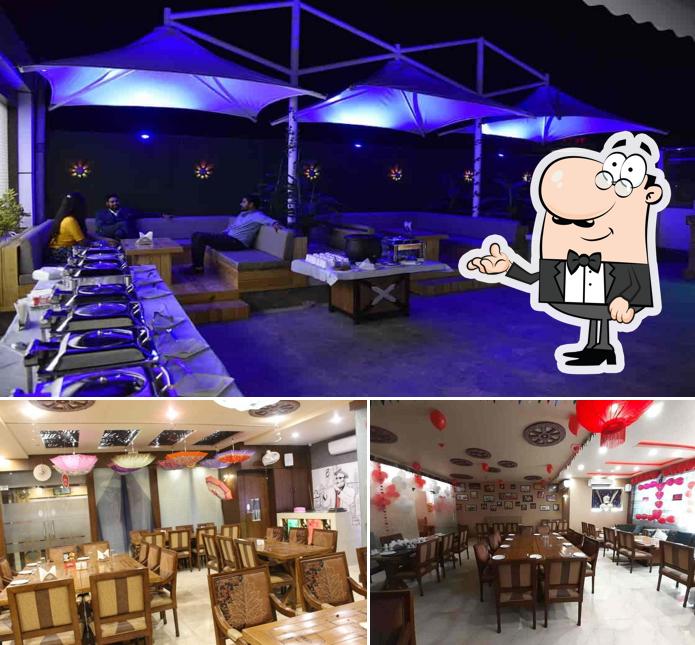 Take a seat at one of the tables at royal spice restaurants & bar