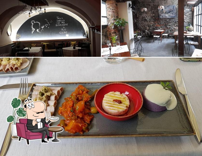 Tra le diverse cose da Trattoria Vecchio Cipresso si possono trovare la interni e cibo