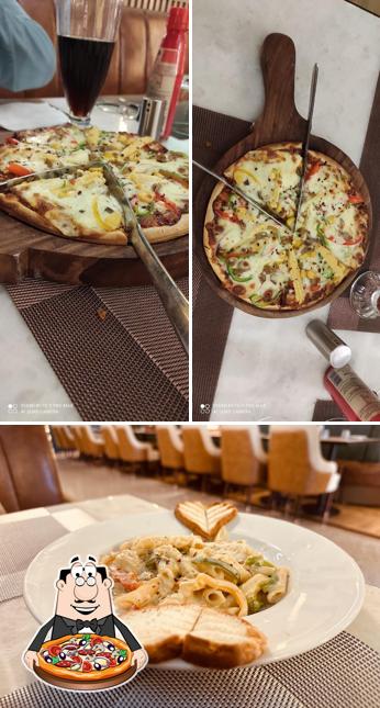 Try out pizza at Zunoon Restaurant & Banquet