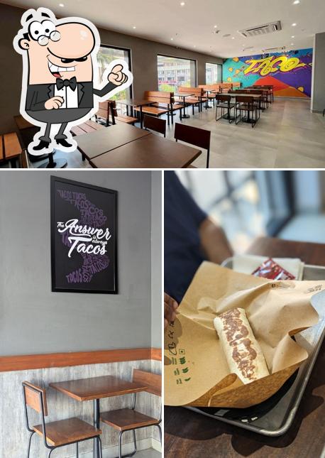 Take a seat at one of the tables at Taco Bell Mangalore Take a seat at one of the tables at Taco Bell Mangalore