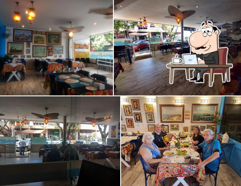 Sente em uma das mesas no Restaurante Atlântica Vitória