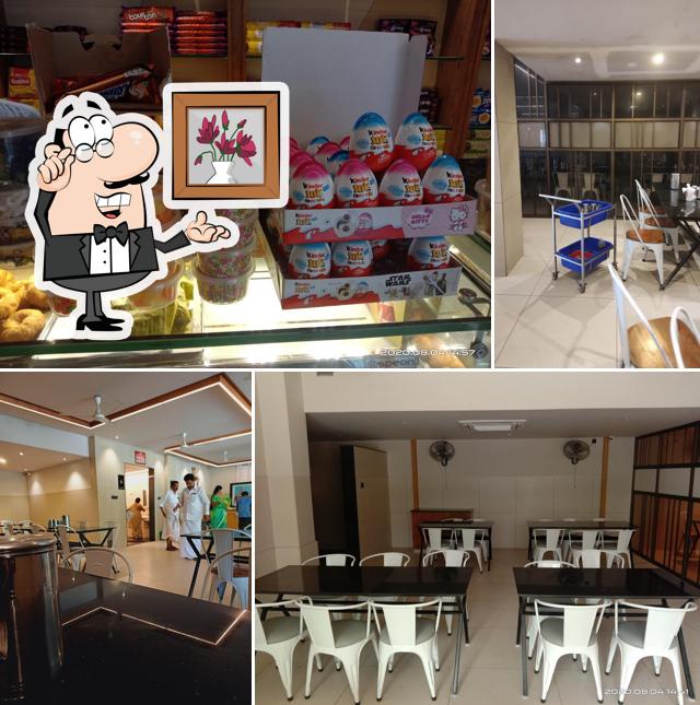 Take a seat at one of the tables at Hotel Sri Bhavan Residency & Restaurant