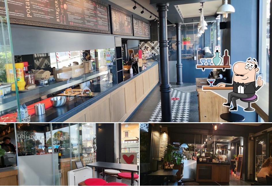 Dai un'occhiata agli interni di Romero Bread & Burger Bar