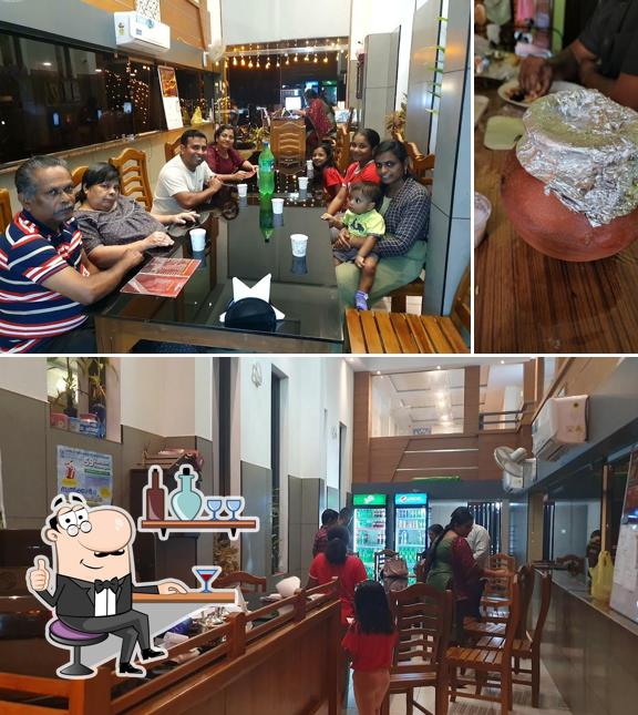 Take a seat at one of the tables at Karsar Almaaedah Restaurant Changanassery