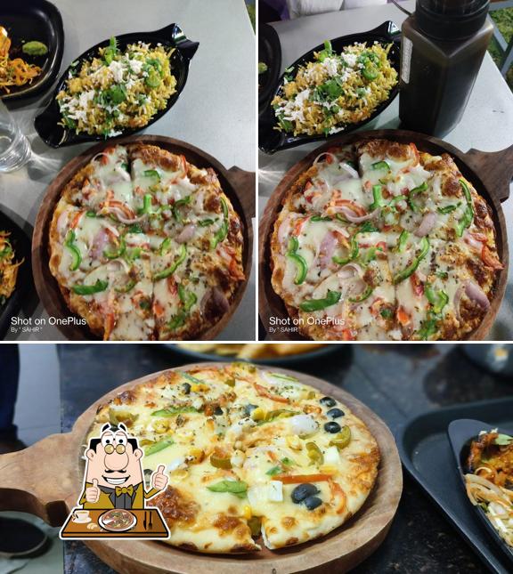 Try out pizza at NB CAFE & RESTRO