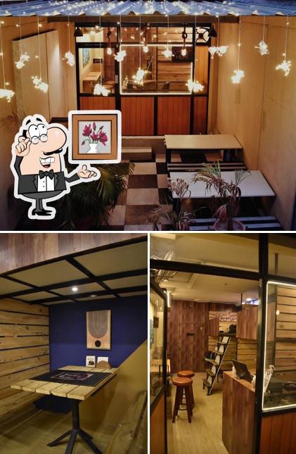 Take a seat at one of the tables at Capsule Cafe