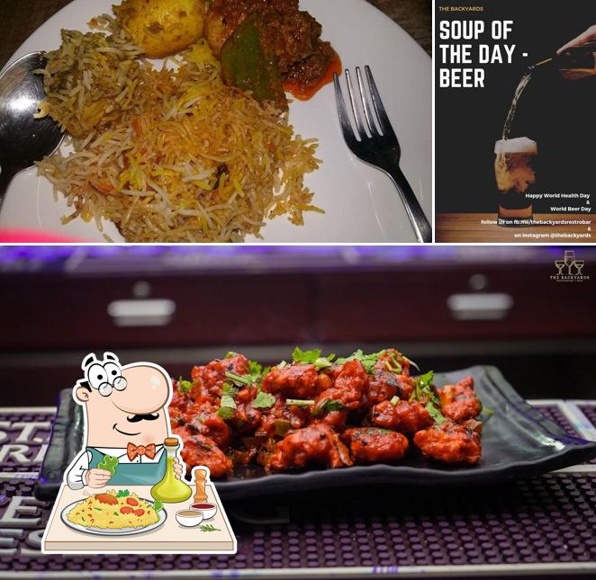 This is the photo showing food and beer at THE BACKYARDS RESTAURANT CUM BAR