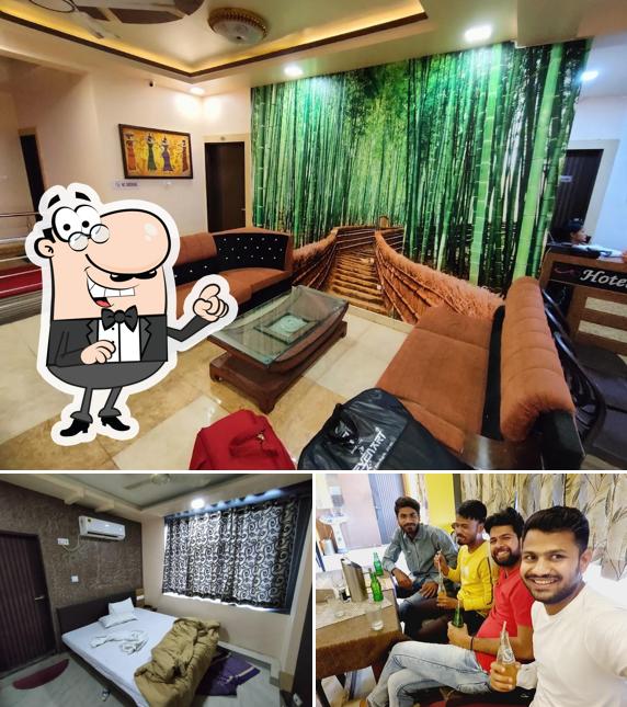 Take a look at the picture showing interior and beverage at Hotel Neelkanth & Tadka restaurant & cafe