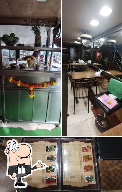 Take a seat at one of the tables at Hotel Supriya