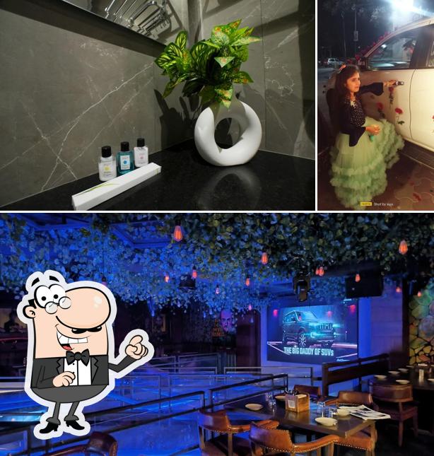 Take a seat at one of the tables at BREAKING BAD(BEAKER PEAKER) -Rooms Bar Couple Cafe in Yamunanagar