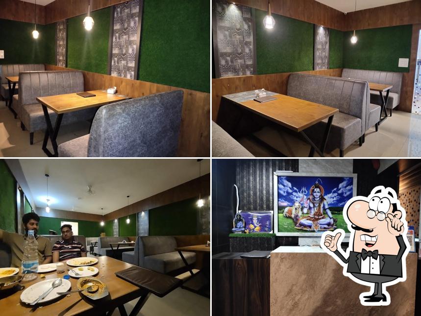 Take a seat at one of the tables at Shree Santosh Family Dhaba and Banquet Hall