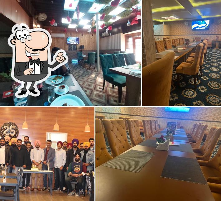 Take a seat at one of the tables at Tasty Tasty (Food Corner)