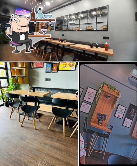 Take a seat at one of the tables at Nescafe