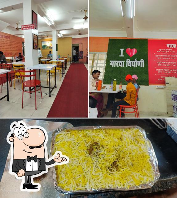 This is the picture depicting interior and food at Garva Biryani