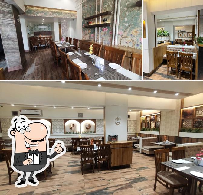 Take a seat at one of the tables at Hotel Murli Pure Veg