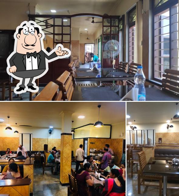 Take a seat at one of the tables at The Punjabi Restaurant