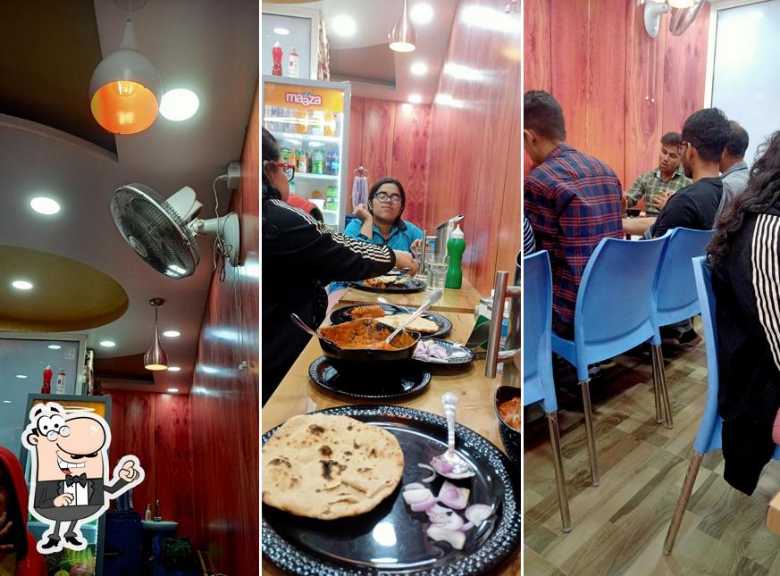 Take a seat at one of the tables at SWAD Sweets & Restaurant (The New Taste Of Ranikhet)