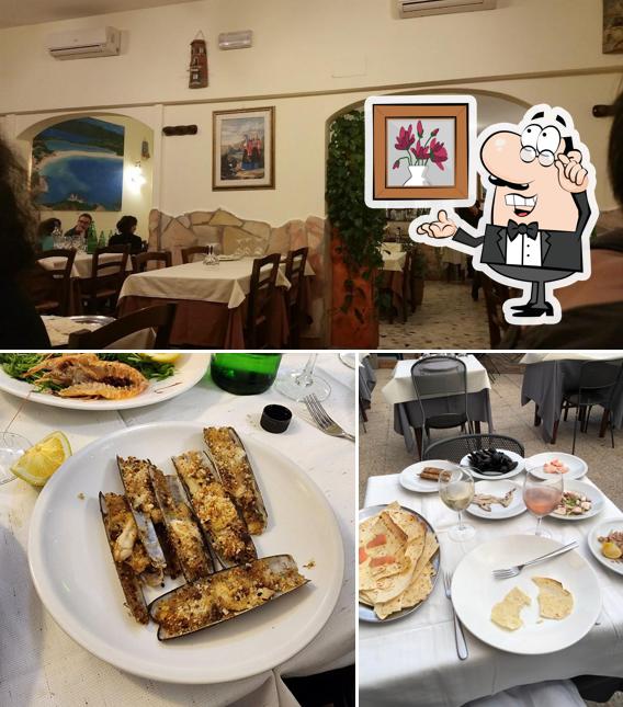 Questa è la foto che presenta la interni e tavolo da pranzo di Canne al Vento