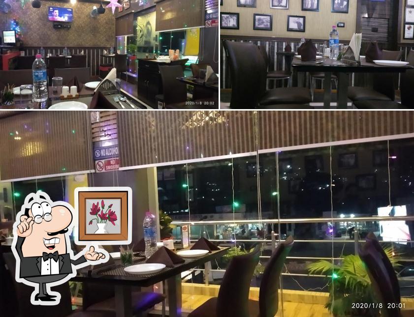 Take a seat at one of the tables at Moti Mahal Delux