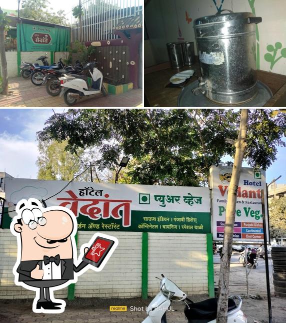 The photo of exterior and beverage at Hotel Vedant