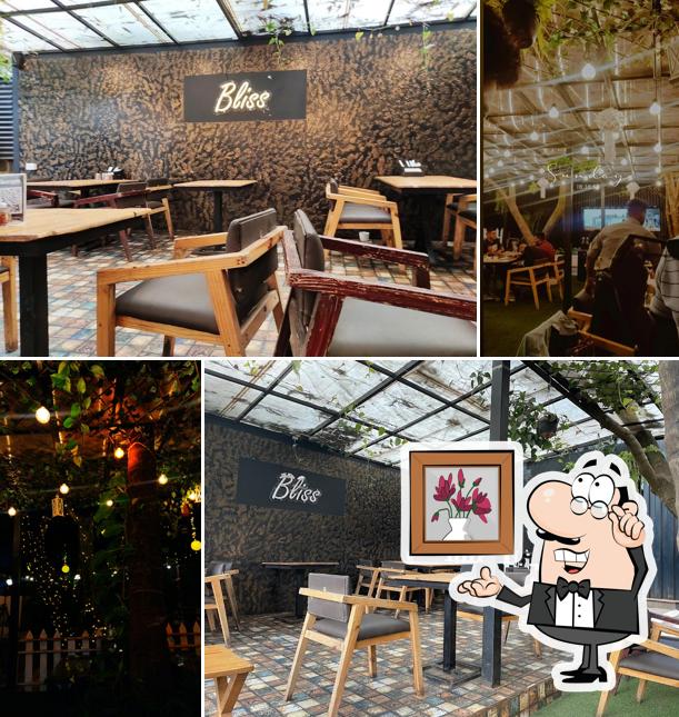 Take a seat at one of the tables at The backyard bistro grill