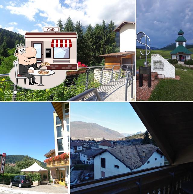 Puoi goderti l'aria fresca da seduto all'esterno di Hotel Dolomiti