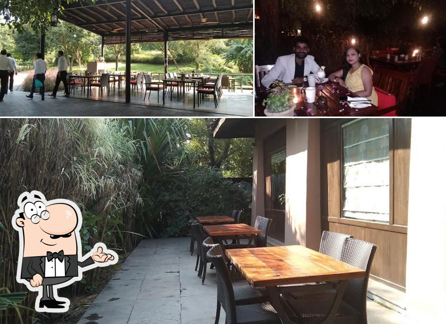 Take a seat at one of the tables at Under the jamun tree restaurant