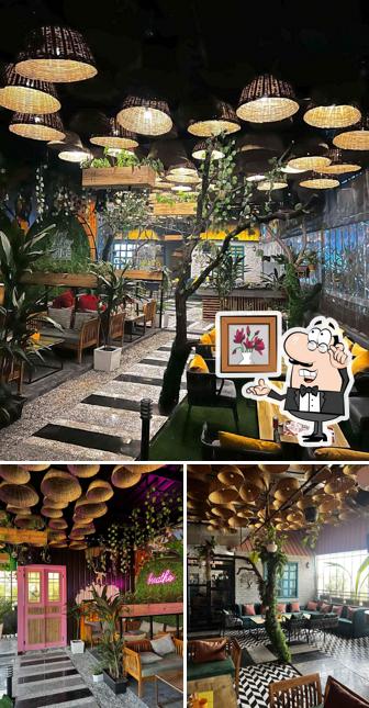 Take a seat at one of the tables at 13Woods Garden Resto & Cafe