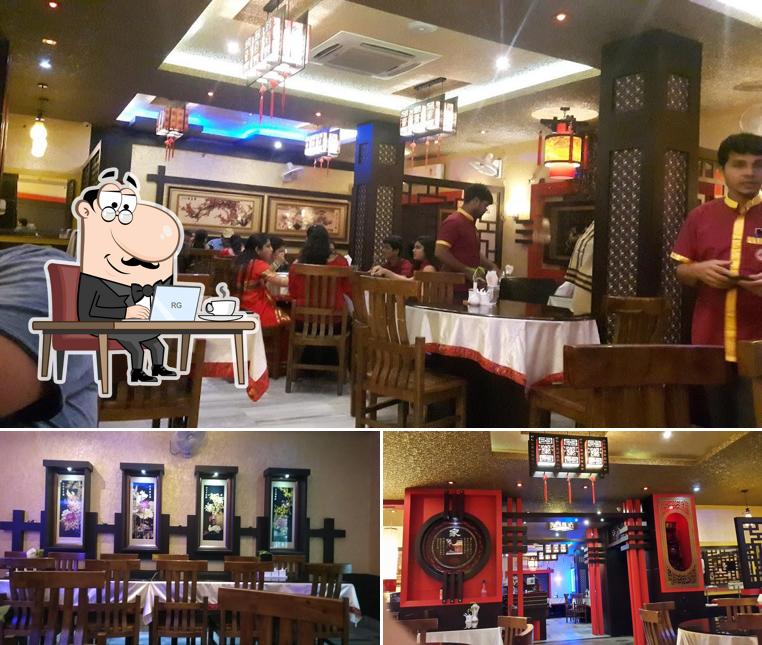 Take a seat at one of the tables at Chung Wah Chinese Restaurant