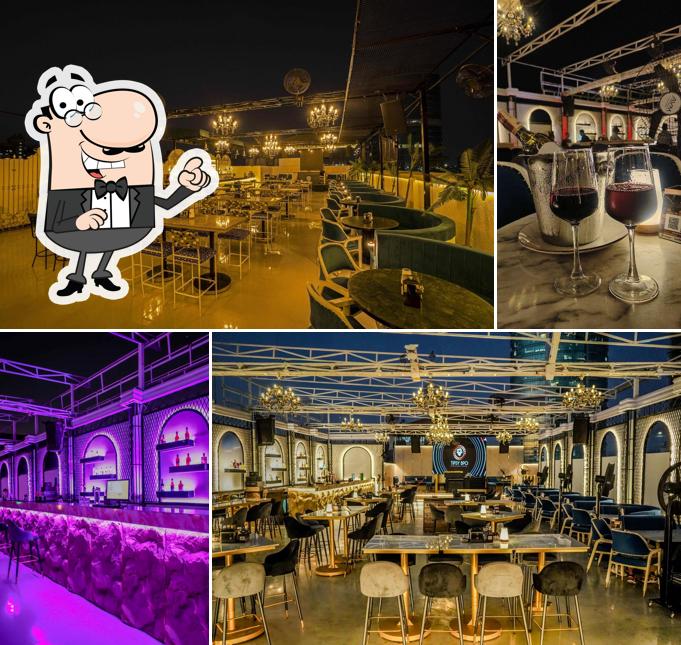 Take a seat at one of the tables at Tipsy Bro - Rooftop Lounge Bar & Luxury Dining