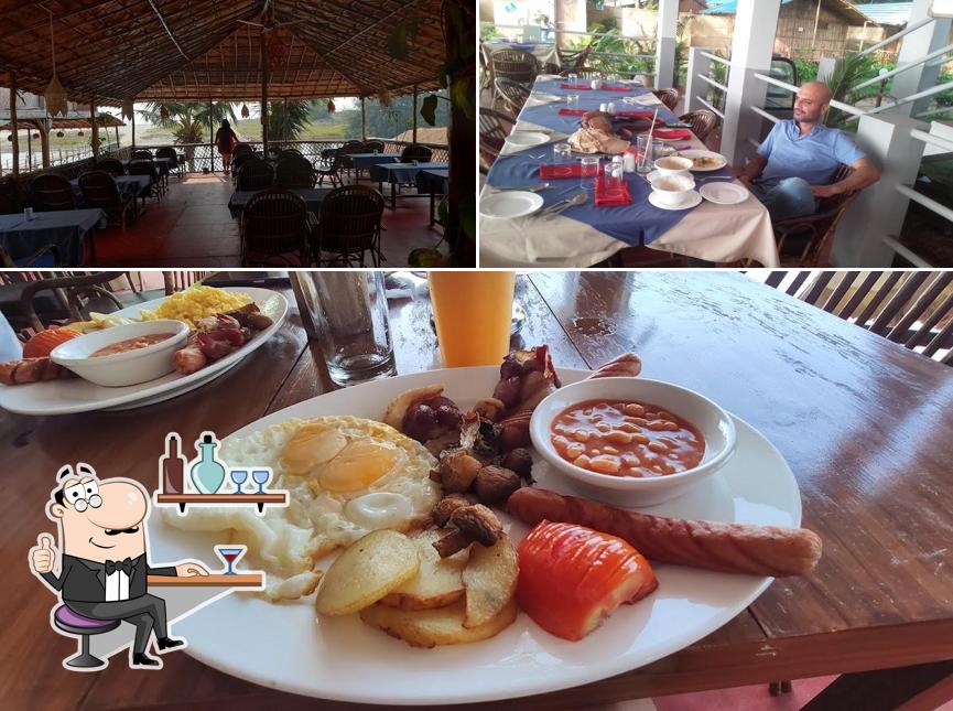 Take a seat at one of the tables at Sunset Waves Resort