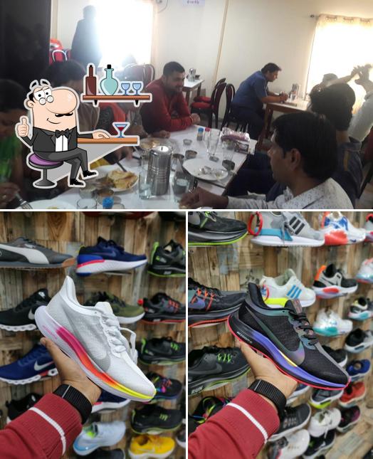 Take a seat at one of the tables at Famous mens wear custom shop 1st copy item available