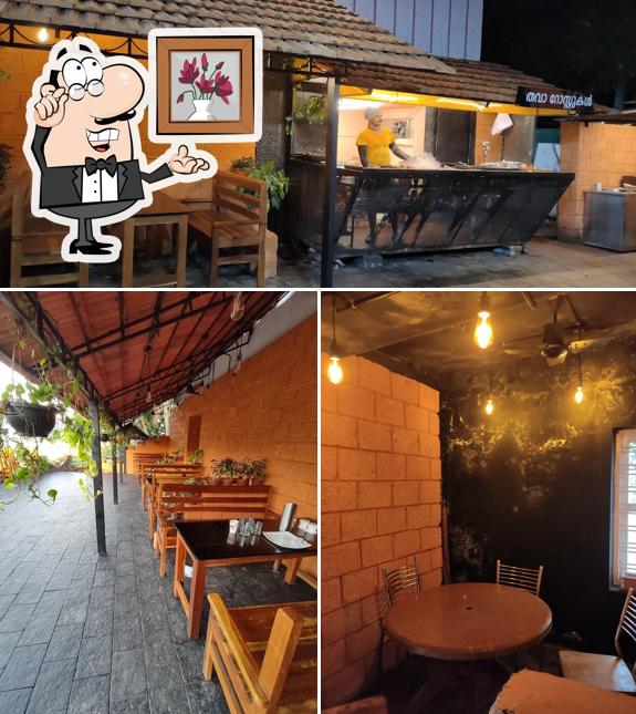 Take a seat at one of the tables at KK Street Food