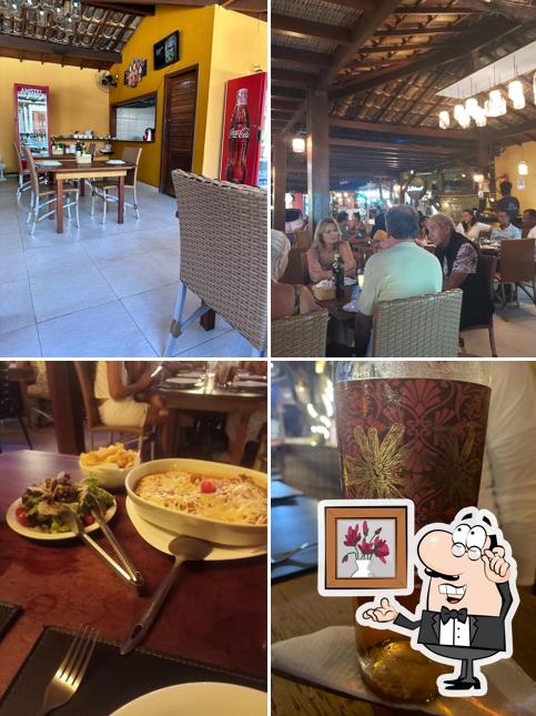 Sente em uma das mesas no Le Restaurant by La Plage