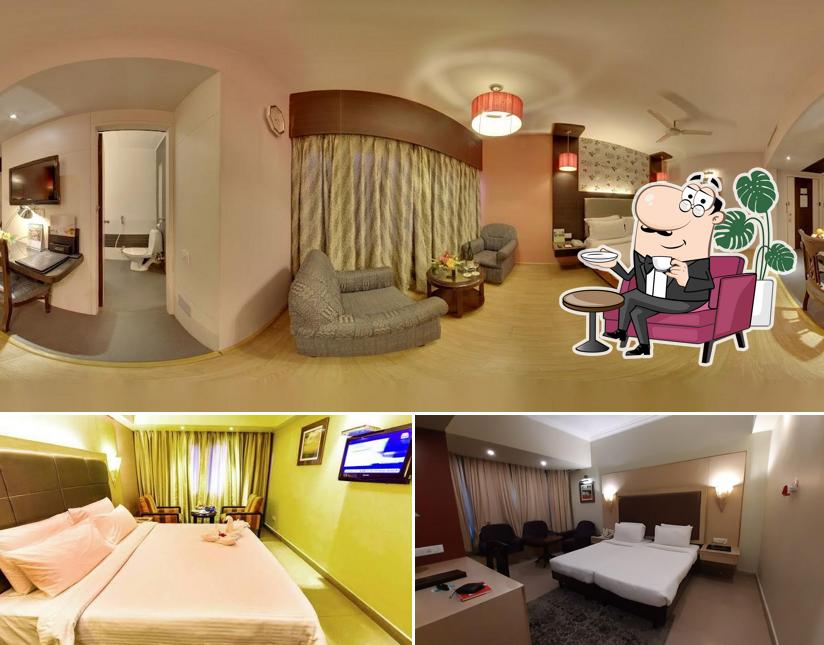 Take a seat at one of the tables at Swosti Grand - Best Hotel near Bhubaneswar Railway Station and Airport