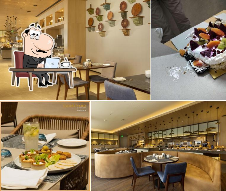 Take a seat at one of the tables at 812 CE - Courtyard By Marriott