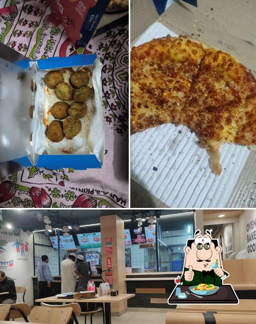 This is the photo depicting food and interior at Domino's Pizza Ghora Nakkas, Bhopal
